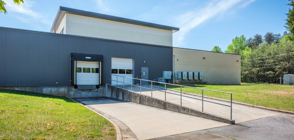 Loading dock and shop side of the Think-PLC building at 2975 Cole Rd